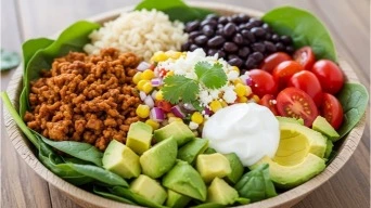 Healthy ground chicken taco bowl with toppings
